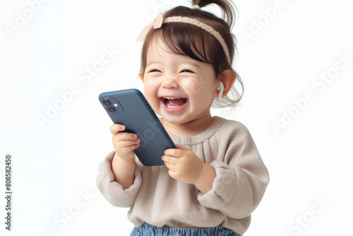 baby holding phone and laughing very much isolated on white background