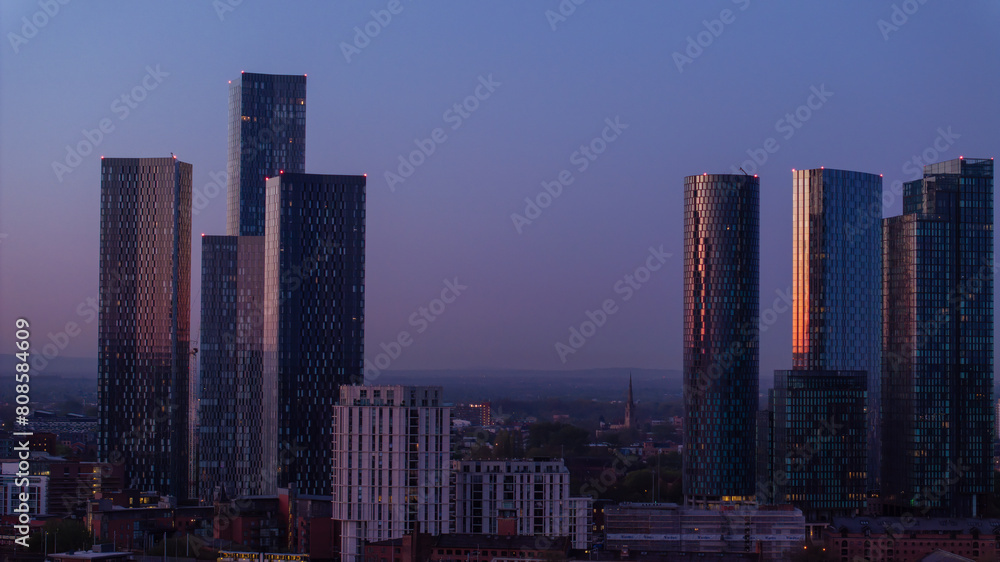 Manchester Twilight skyline with illuminated skyscrapers