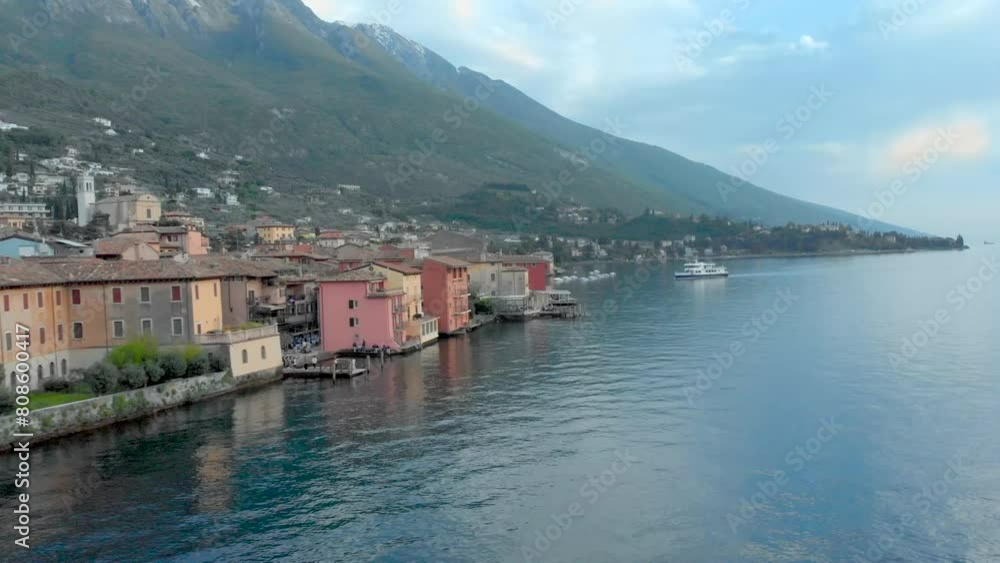 Discover the allure of Malcesine Castle against a backdrop of azure skies and tranquil waters along the Lake Garda coastline Discover the allure of Malcesine Castle against a backdrop of azure skies and tranquil waters along the Lake Garda coastline