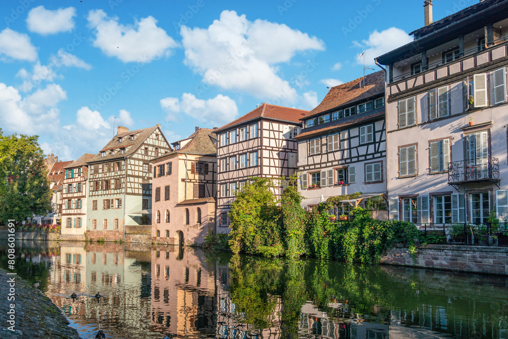 Le Petite France, the most picturesque district of old Strasbourg. Half-timbered houses with reflection in waters of the Ill channels. Le Petite France, the most picturesque district of old Strasbourg. Half-timbered houses with reflection in waters of the Ill channels.
