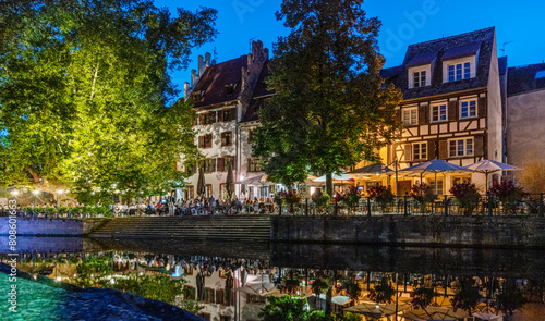 Le Petite France, the most picturesque district of old Strasbourg. Houses with reflection in waters of the Ill channels in the evening twilight.