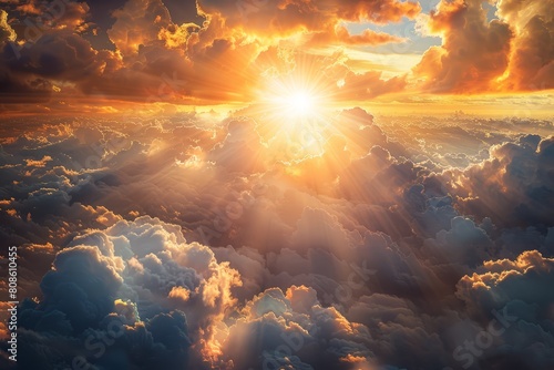 Sun illuminating clouds in the sky with radiant golden rays