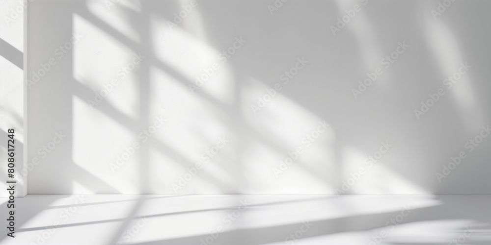Minimalistic white room interior with sunlight casting soft shadows through window blinds Minimalistic white room interior with sunlight casting soft shadows through window blinds
