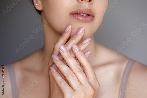 Manicure and Hands Spa. Beautiful model girl with a manicure nails. Woman natural makeup and care for hands cosmetics. Facial treatment . Cosmetology, beauty. Skin care