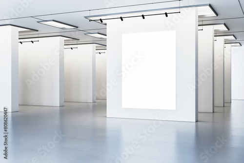 Blank poster mockups in a bright gallery space with overhead lighting  modern design on a white background  concept of an art exhibition. 3D Rendering