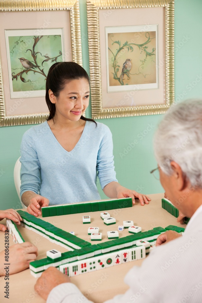 Fototapeta premium The family playing mahjong