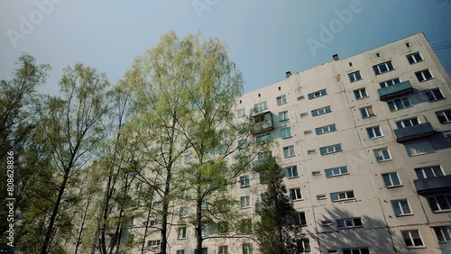 Highrise Russian architecture prefab apartment during spring with balcony and window photo