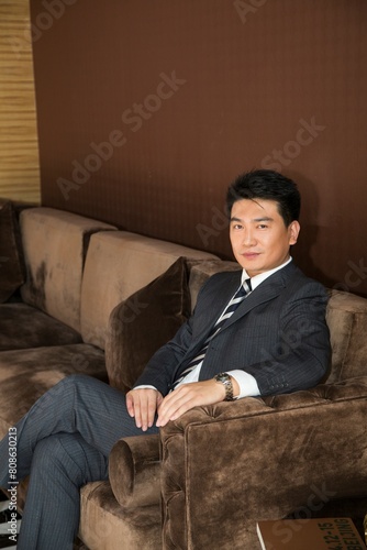 Middle age business man sitting on the sofa © Best View Stock