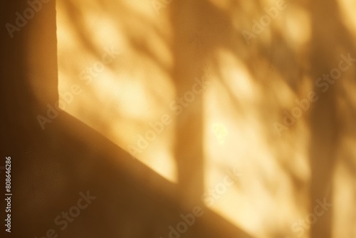Tranquil, abstract background with soft golden tones and delicate shadow play