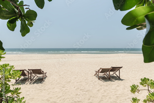 Beach chairs on the white sand beach © yotrakbutda