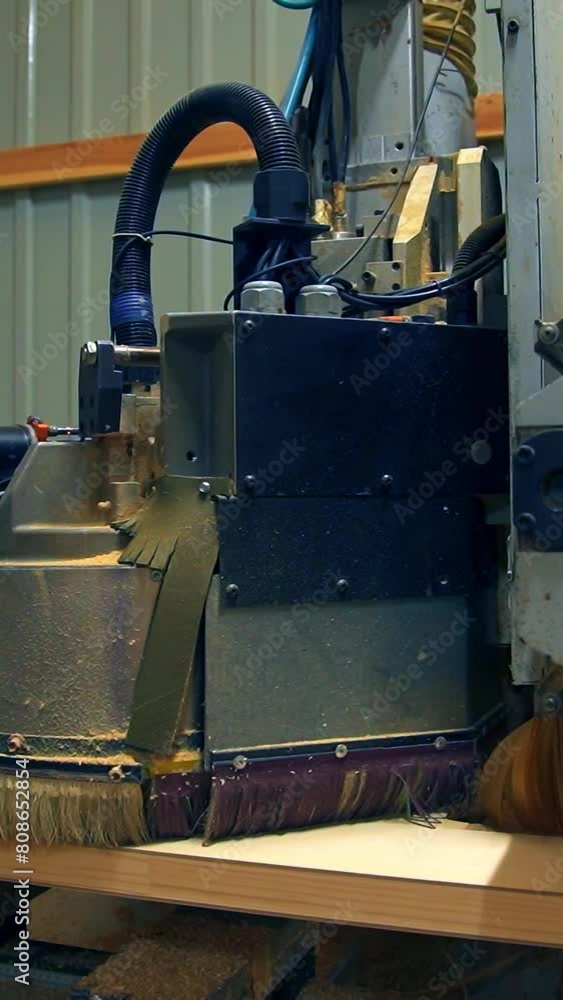 Polishing the wooden part of the future door. Automatic tool machine moves over the surface of timber plank. Vertical video Polishing the wooden part of the future door. Automatic tool machine moves over the surface of timber plank. Vertical video