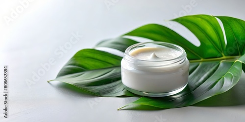 Jar of body cream and green leaf on white table  closeup. AI generated 