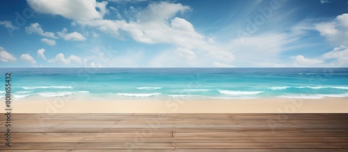 A tropical sandy beach with a wooden floor in the foreground leading to a horizon with a sea background The blue sea and clouds provide a serene view perfect for relaxation vacation and daydreaming A