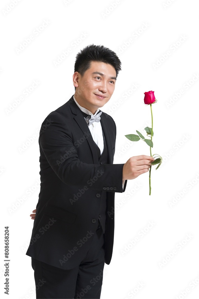 Shed middle-aged business man holding a rose Shed middle-aged business man holding a rose