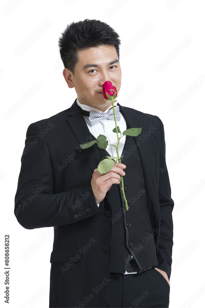 Shed middle-aged business man holding a rose Shed middle-aged business man holding a rose