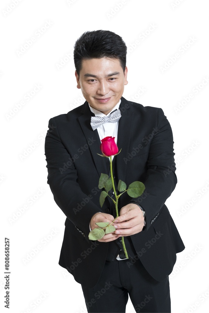 Shed middle-aged business man holding a rose Shed middle-aged business man holding a rose