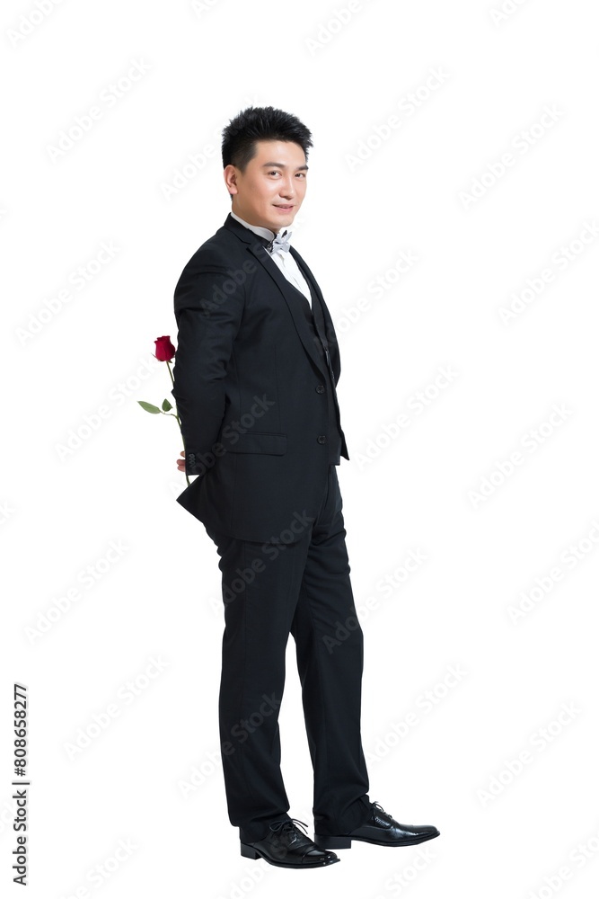 Shed middle-aged business man holding a rose Shed middle-aged business man holding a rose