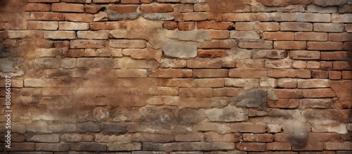 A textured background of an ancient brick wall in a medieval setting with plenty of copy space for images