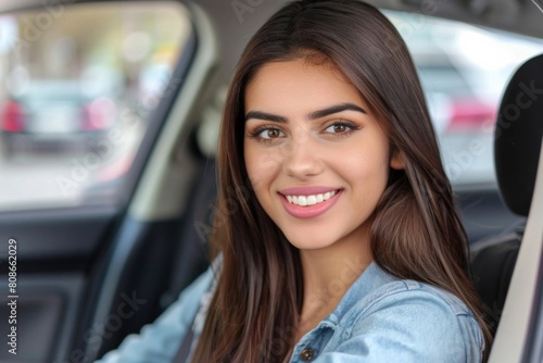 Young Woman Smiling in Driver Seat of Car - Lifestyle, Freedom, Automotive Industry © melhak
