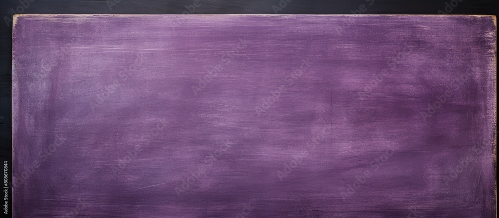 Fototapeta premium Copy space image of a purple blackboard with a blank chalkboard texture