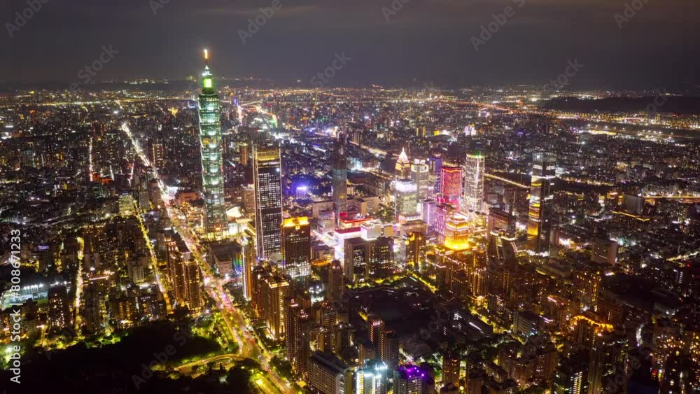 Aerial hyperlapse at sunset above Downtown Taipei, the vibrant capital of Taiwan, with 101 Tower standing out amid skyscrapers in XinYi Commercial District and city lights dazzling under twilight sky Aerial hyperlapse at sunset above Downtown Taipei, the vibrant capital of Taiwan, with 101 Tower standing out amid skyscrapers in XinYi Commercial District and city lights dazzling under twilight sky