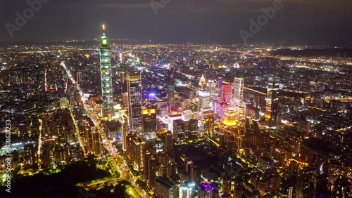Wallpaper Mural Aerial hyperlapse at sunset above Downtown Taipei, the vibrant capital of Taiwan, with 101 Tower standing out amid skyscrapers in XinYi Commercial District and city lights dazzling under twilight sky Torontodigital.ca