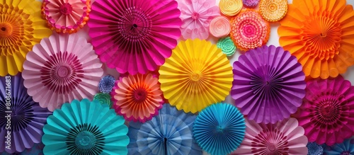 Colorful round rosettes create an eye catching display for various celebrations such as parties New Year s bachelorettes birthdays and carnivals The vibrant paper decorations and garlands add a festi