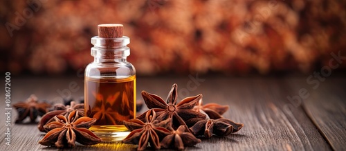 Aromatic essential oil with star anise in a bottle featuring copy space for easy customization