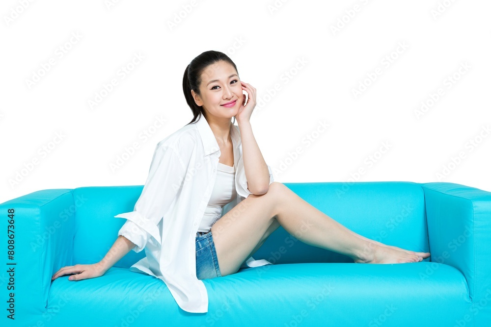 Shed young woman sitting on the sofa to rest Shed young woman sitting on the sofa to rest