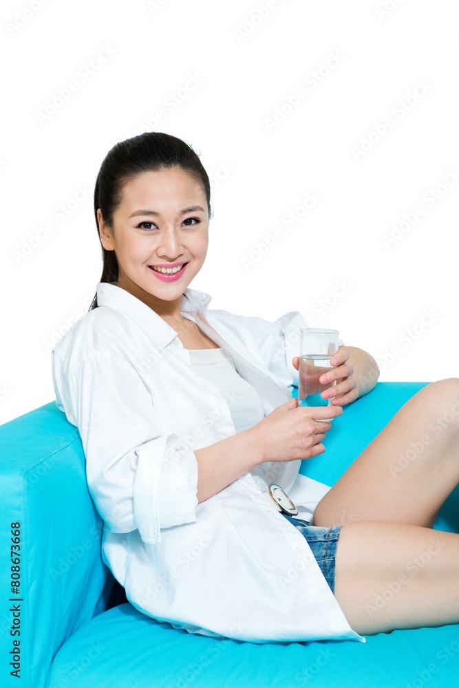 Shed young woman sitting on the sofa to rest Shed young woman sitting on the sofa to rest