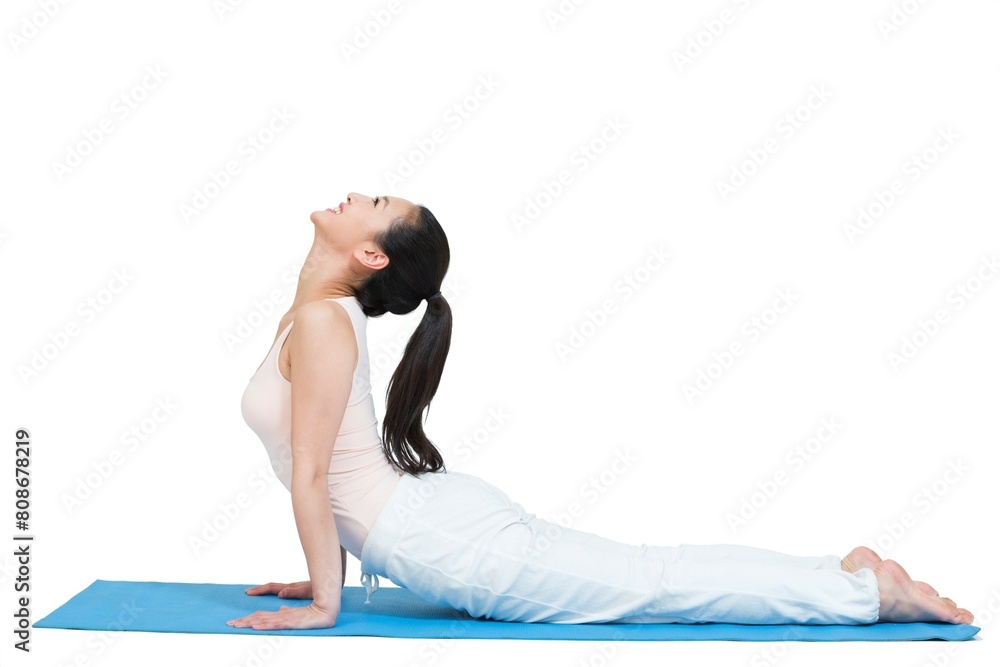 Shed young woman doing yoga