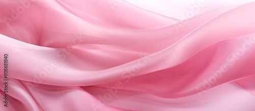 The pink ribbon is a globally recognized symbol for breast cancer awareness providing moral support to women The image shows a close up top down view of the ribbon with an isolated background and cop