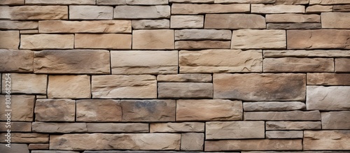 A visually appealing copy space image of a natural stone brick wall with visible joints