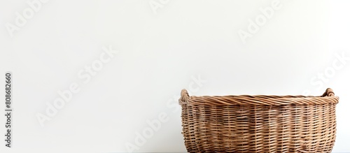 A wicker basket is featured in a copy space image with a white background photo
