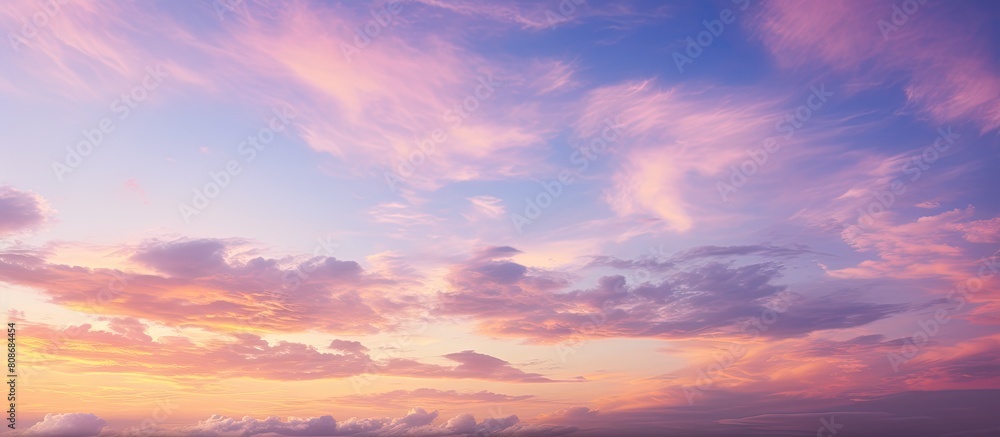 Fototapeta premium A stunning color combination of magenta and yellow fills the sky during the golden hour creating a captivating skyscape for sky replacement in landscape orientation Copy space image