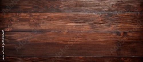 Top view of a wooden background serving as a textured surface with copy space for images