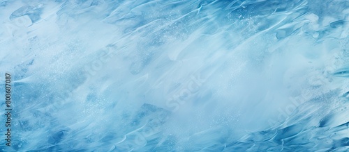 A winter themed image with a texture resembling frozen water The ice surface creates an abstract blue background perfect for a copy space image