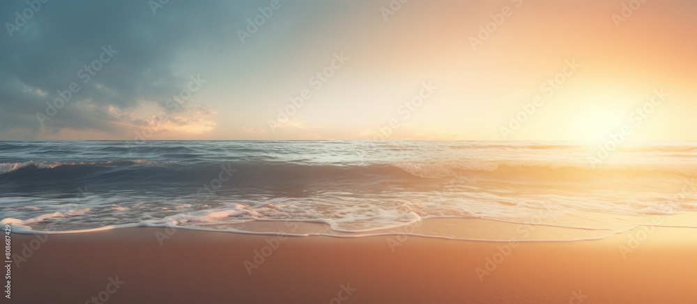 Beautiful beach with perfect sand illuminated by the lovely backlight creating a stunning copy space image
