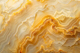 A closeup of an agate surface, showcasing the intricate patterns and colors in shades of yellow and brown. The background is a soft gradient from light to dark beige
