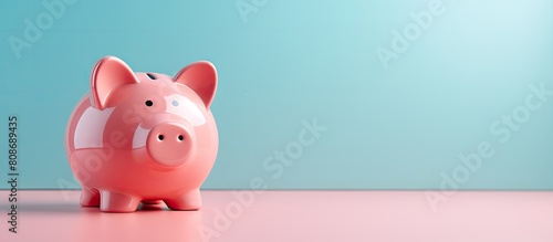 A pink piggy bank positioned on a trendy modern background symbolizes the concept of saving for retirement and financial security The image offers a top down perspective with copy space