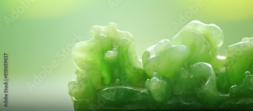 Green jade or nephrite creates a light green blurred background with plenty of copy space image photo