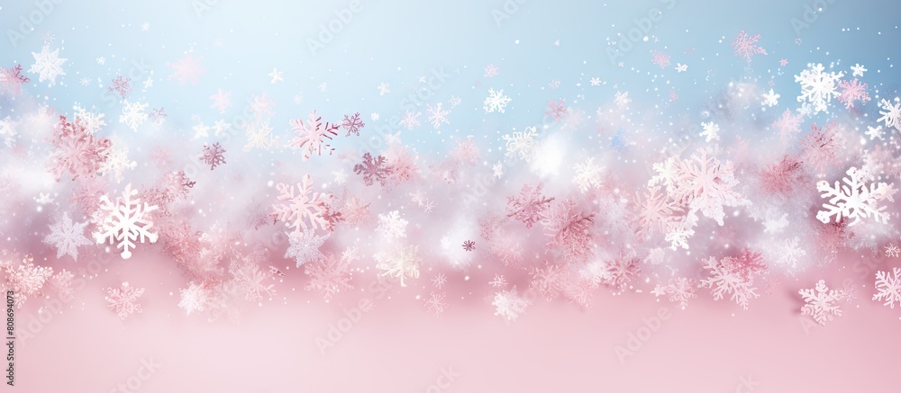 A festive holiday background with white and blue snowflakes sprinkled on pink The image showcases a celebration concept with a top view and a horizontal wide screen format. Copy space image A festive holiday background with white and blue snowflakes sprinkled on pink The image showcases a celebration concept with a top view and a horizontal wide screen format. Copy space image