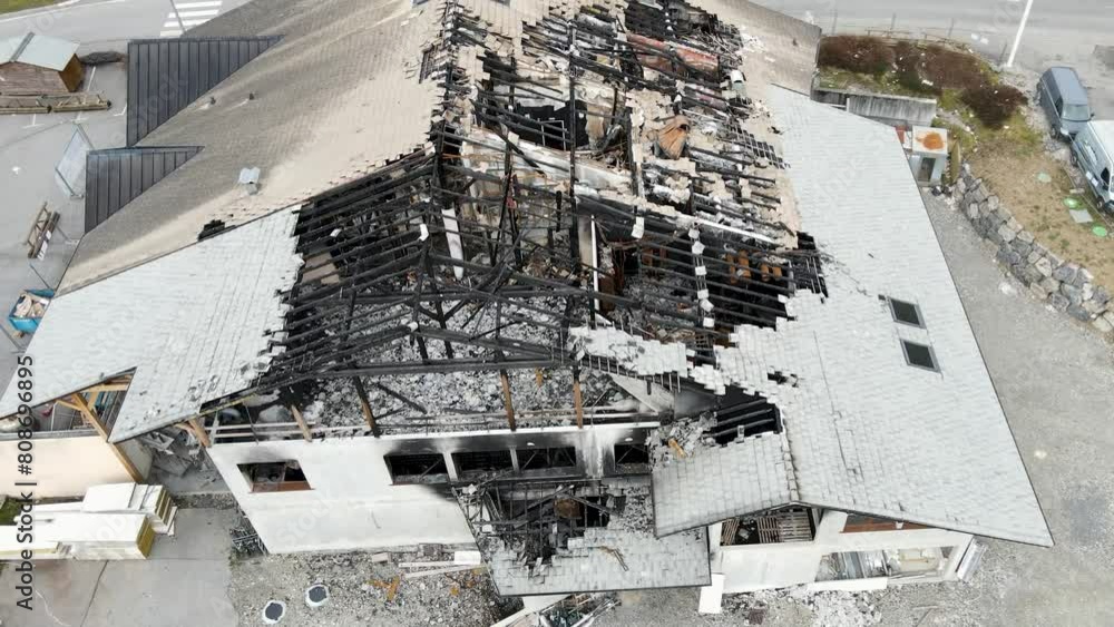 leftovers of a building and tis roof after a fire damage leftovers of a building and tis roof after a fire damage
