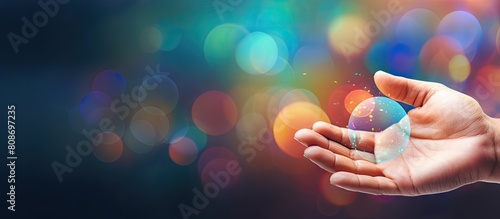 A male hand with an open palm is seen in the bottom left corner of the Rainbow Bubble Message Banner Template The background consists of a wide multicolored bubble bokeh providing space for text