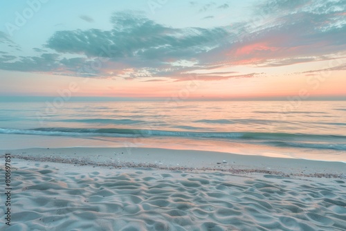 Pastel sunset over tranquil sandy beach