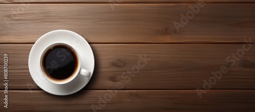 Top view of a wooden table with a white cup of espresso coffee and a black cup of hot coffee leaving plenty of space for an image. Copy space image. Place for adding text and design