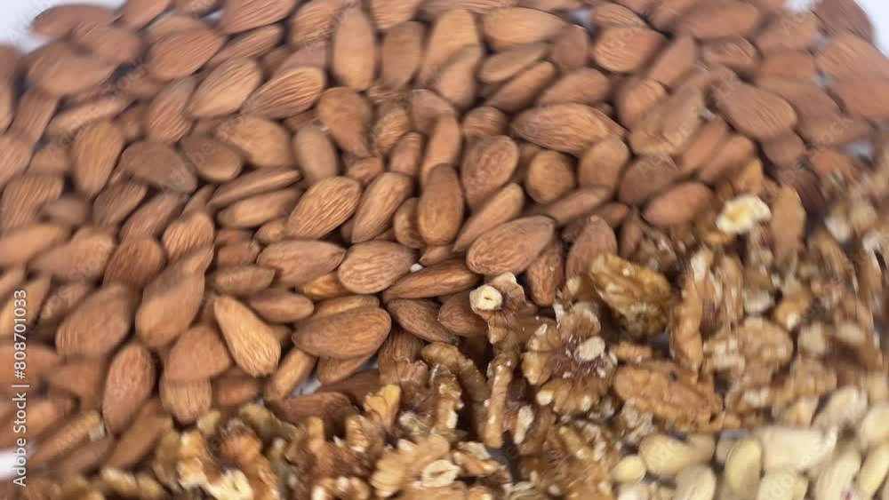 Almond, cashew and brazilian nuts are spinning on board Almond, cashew and brazilian nuts are spinning on board