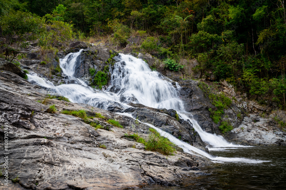 the waterfall on the mountain in thailand with dramatic tone