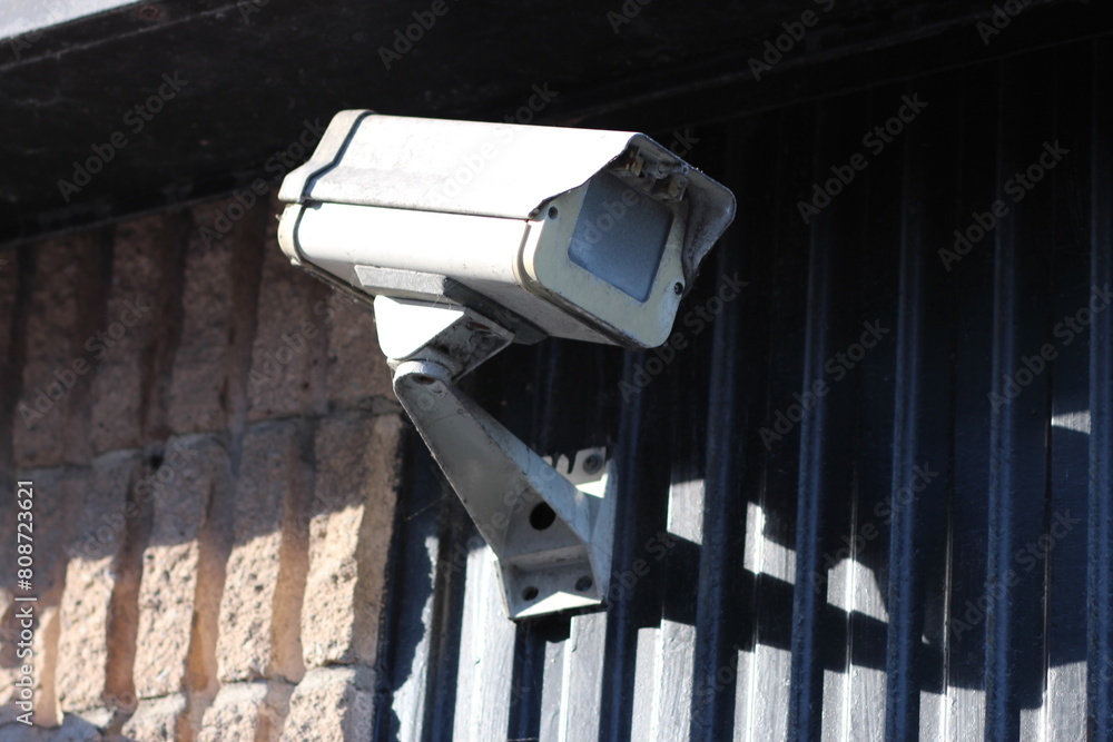 Outdoor security camera on building corner Outdoor security camera on building corner