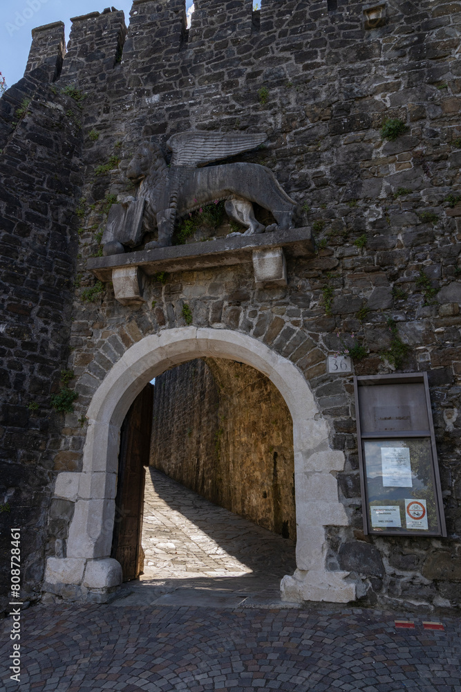 Fototapeta premium City of Gorizia, Castel on top the hill, wall and fortification, cannons. Panorama whole city. The beautiful streets and the castle behind them are a trace of history. Cultural Heritage Capital 2025.